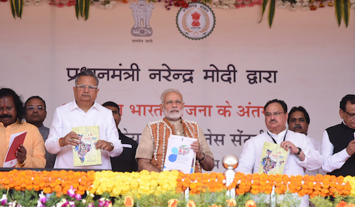 The Prime Minister, Shri Narendra Modi inaugurating the Health and Wellness Centre to mark the launch of Ayushman Bharat, in Bijapur, Chhattisgarh on April 14, 2018. The Chief Minister of Chhattisgarh, Dr. Raman Singh and the Union Minister for Health & Family Welfare, Shri J.P. Nadda are also seen.